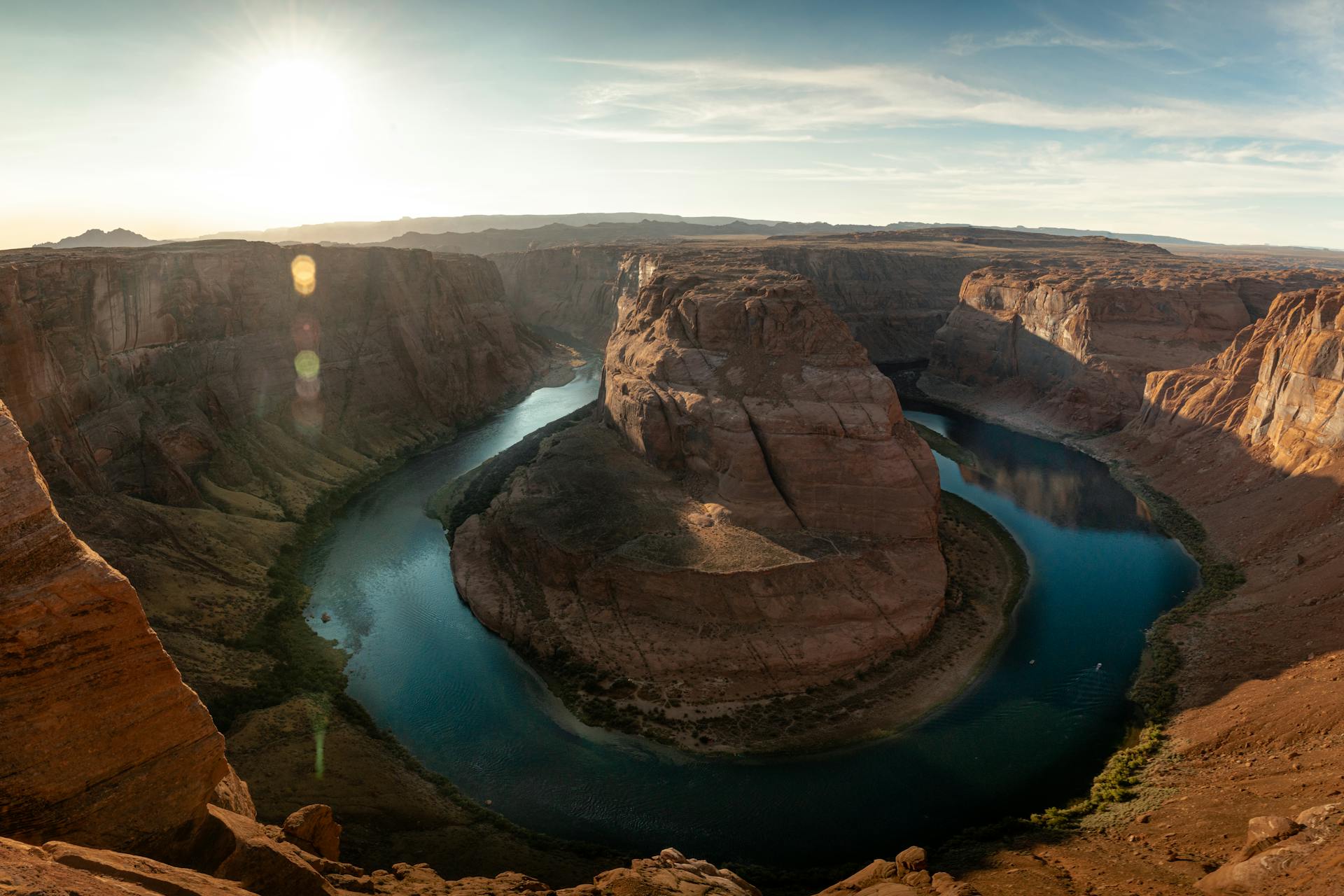 Aerial view of the Colorado River bending around a sandstone butte near Page, Arizona, evoking Horseshoe Bend