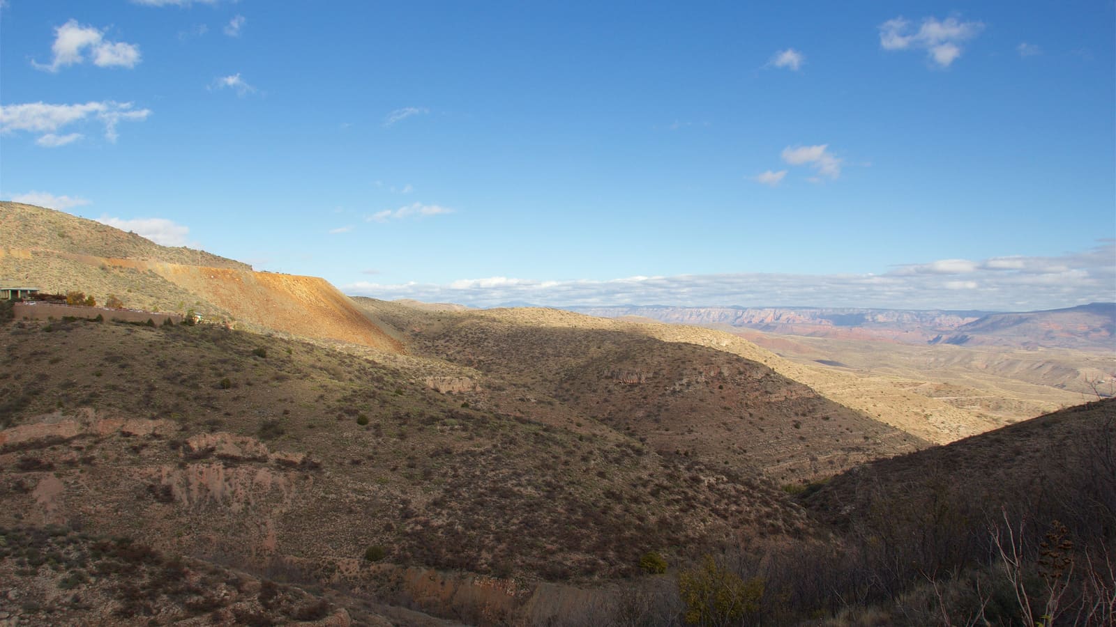 A view of Jerome, Arizona's hillside buildings overlooking the Verde Valley, the destination of the Phoenix day trip.