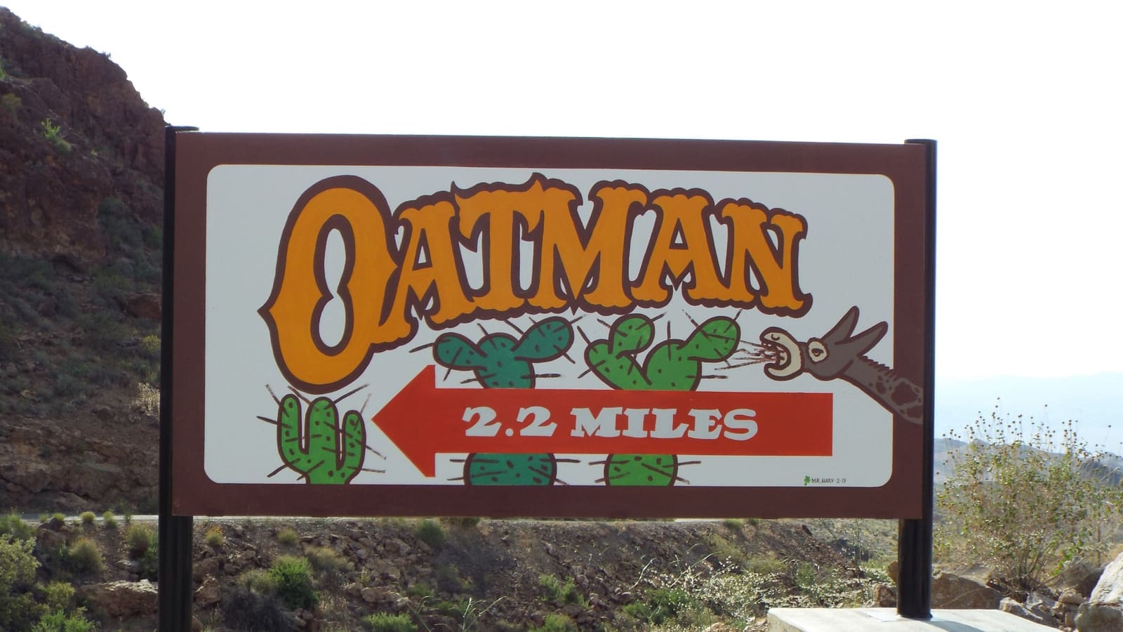 A Welcome to Oatman sign at the Route 66 ghost town near Lake Havasu, Arizona