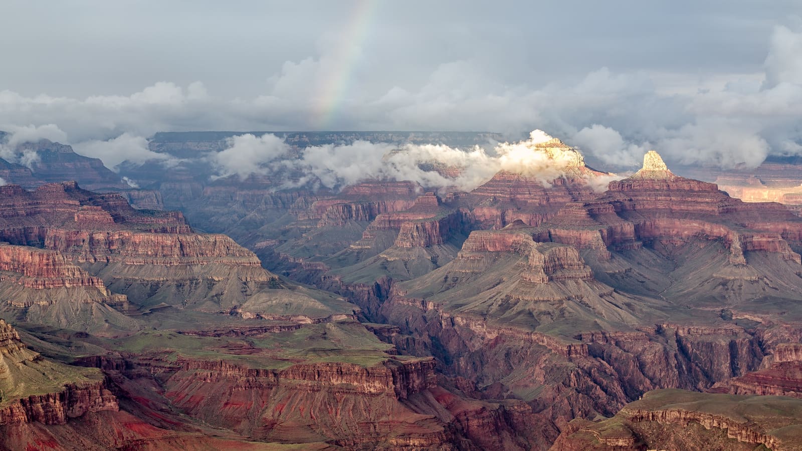 The Grand Canyon South Rim seen from Hopi Point with a rainbow
