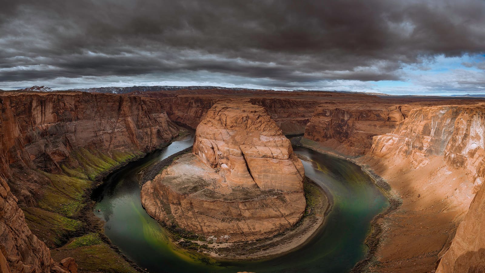 Storm light over Horseshoe Bend on the Colorado River near Page, Arizona