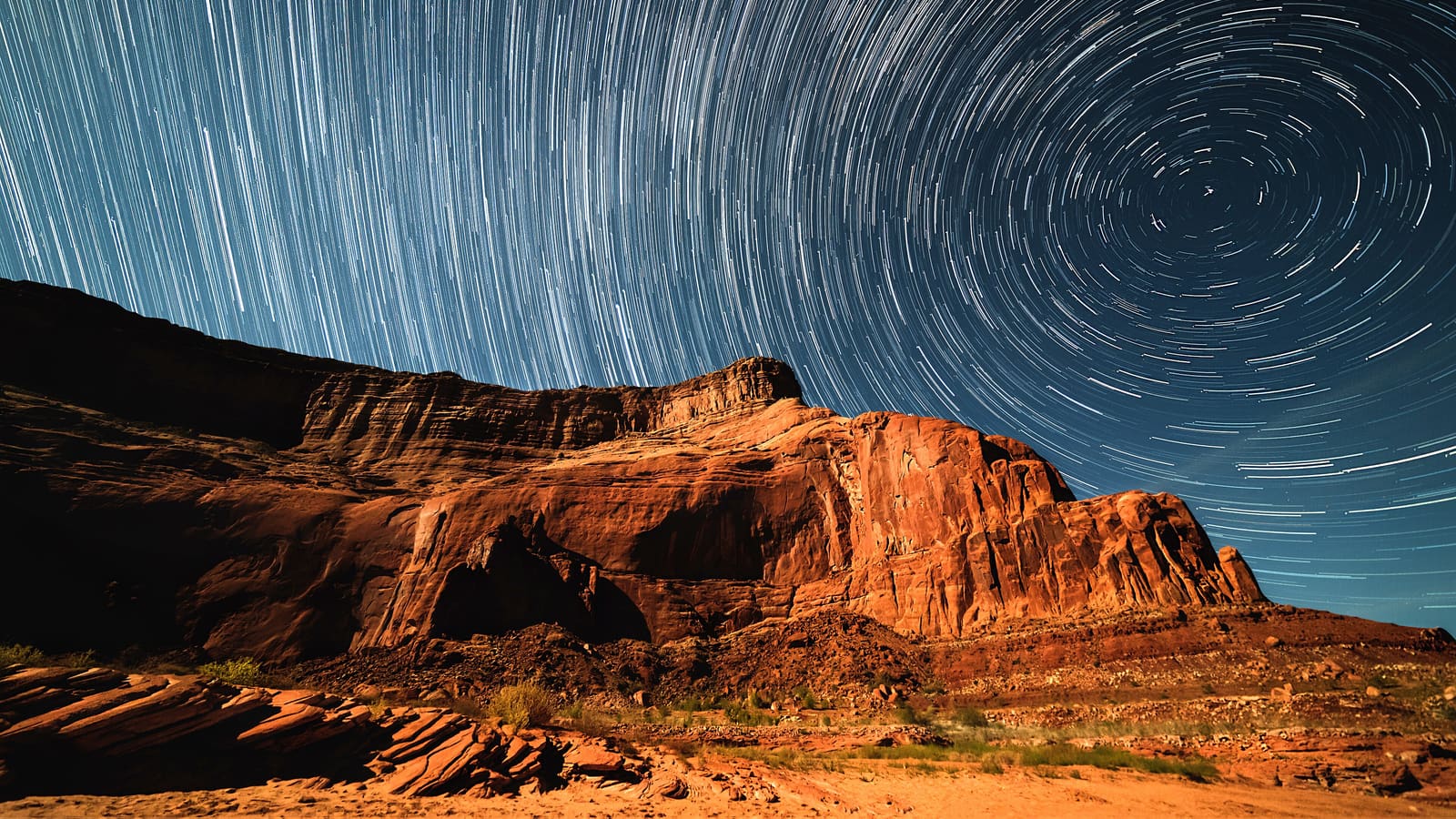 Star trails swirling in the night sky over Lake Powell near Page, Arizona.