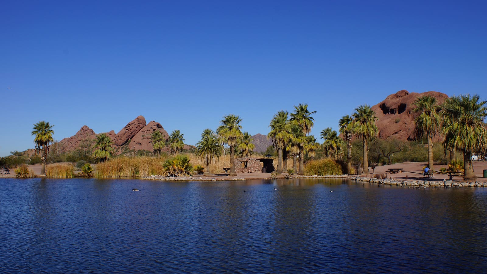 The Papago Buttes and Hole-in-the-Rock formation at Papago Park in Phoenix, with Camelback Mountain in the distance