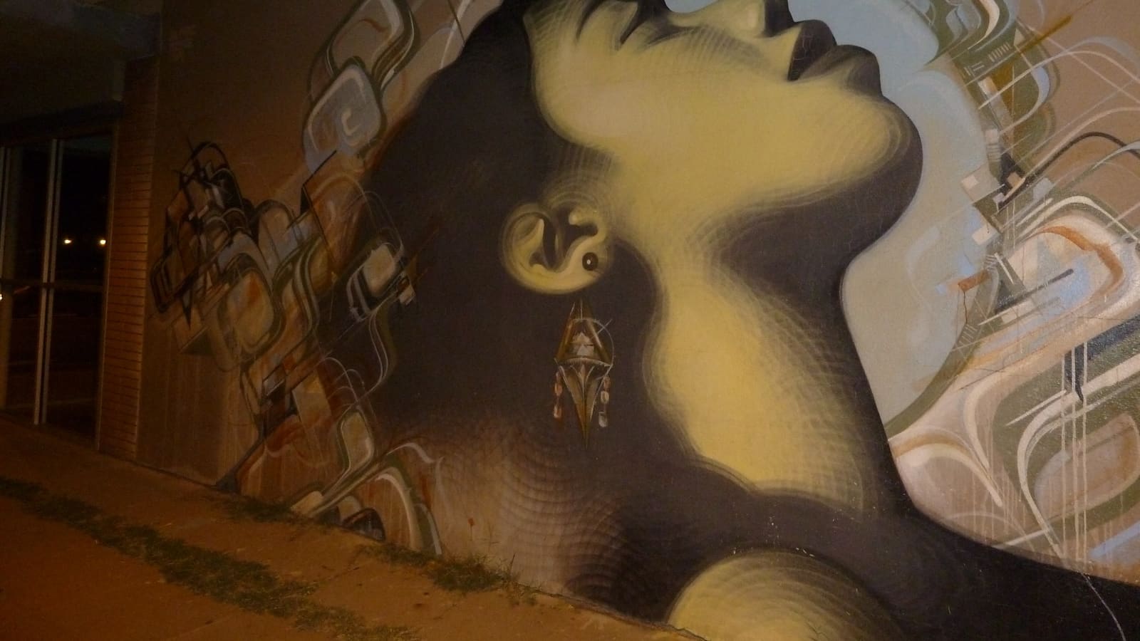 Street murals by artists Bliss, El Mac, and Kofie in the Roosevelt Row arts district of downtown Phoenix, Arizona.