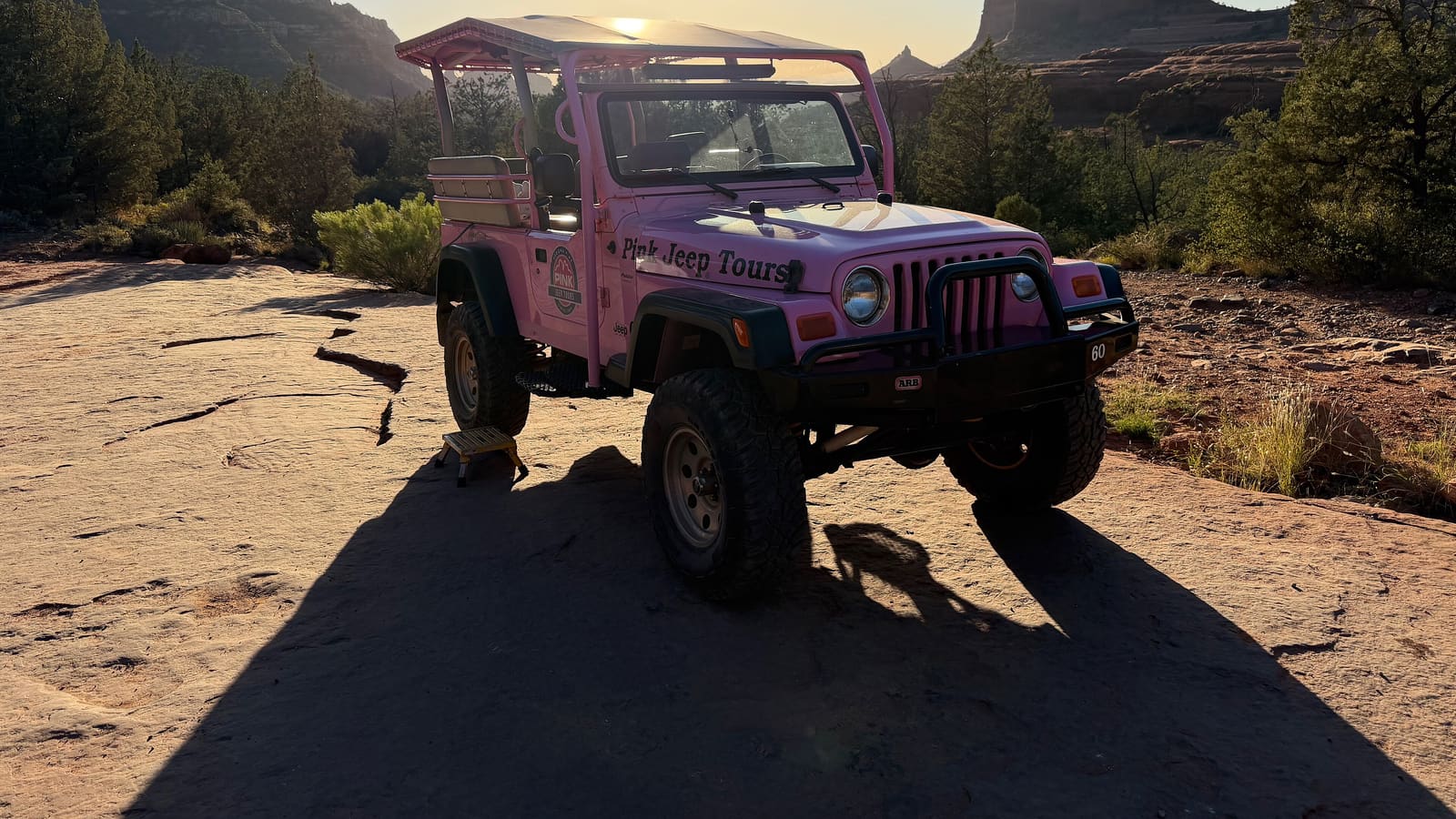 A Pink Jeep Tours vehicle on Schnebly Hill Road in Sedona, Arizona