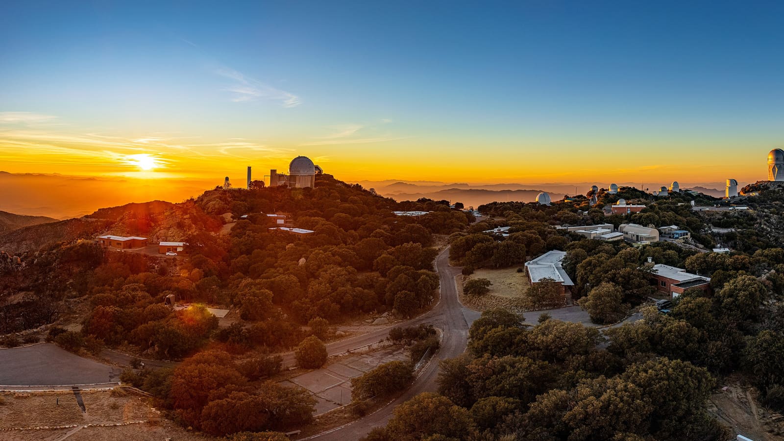 Kitt Peak National Observatory's telescope domes at sunset near Tucson, Arizona